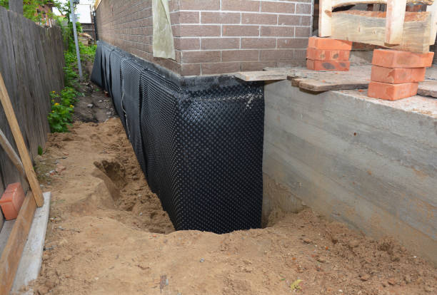 SJ Waterproofing Pros technician performing targeted Waterproofing assessment in Lynchburg, OH